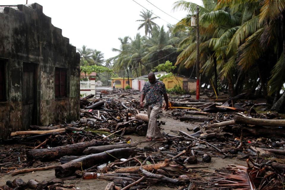  A man walks among debris after Hurricane Irma swept through his community in Nagua, Dominican Republic