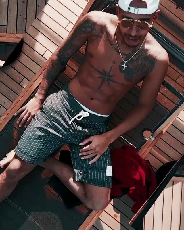 Lewis Hamilton relaxes on a luxury yacht while in Monaco for the Grand Prix