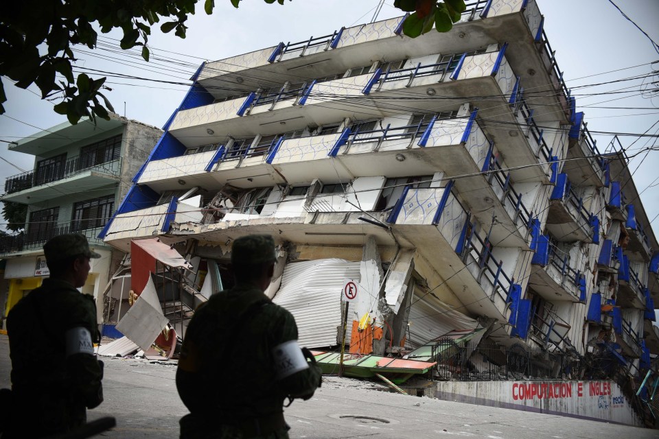 Soldiers stand guard outside the collapsed Sensacion hotel in Matias Romero, Mexico following the Mexico earthquake