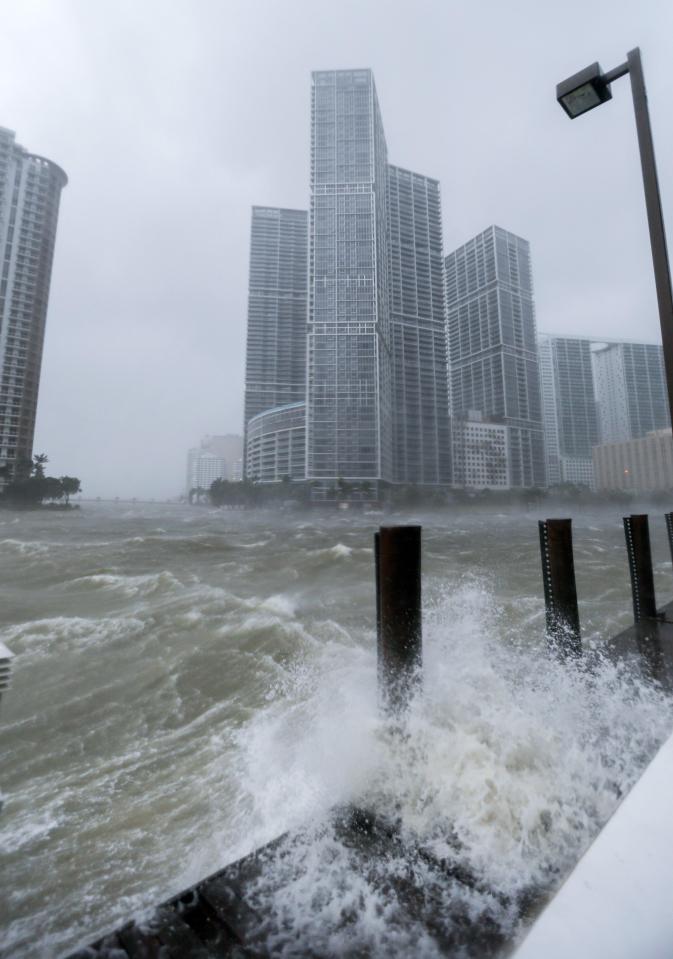  Torrents of water rush through the city of Miami near Biscayne Bay