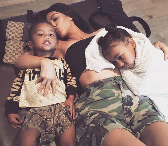  Loved up Kim dotes on her two children