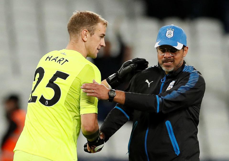  Terriers boss David Wagner congratulates Hart on the win and clean sheet