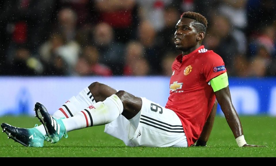  Paul Pogba goes to ground after suffering hamstring injury