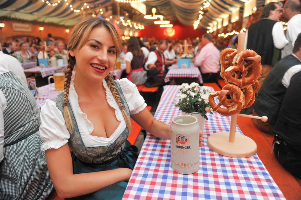 Our girl takes a well-earned rest and enjoys a beer and a pretzel