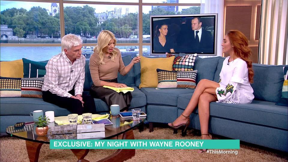 Laura appearing on This Morning to talk with Holly and Phil about her night out with Rooney