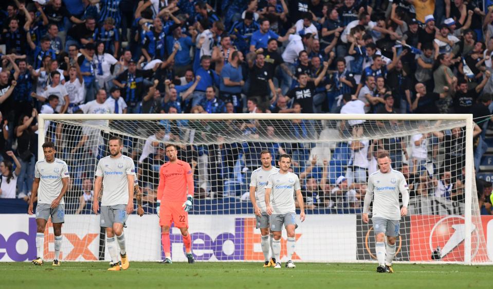  Wayne Rooney and his team-mates look dejected during the match against the Italian side