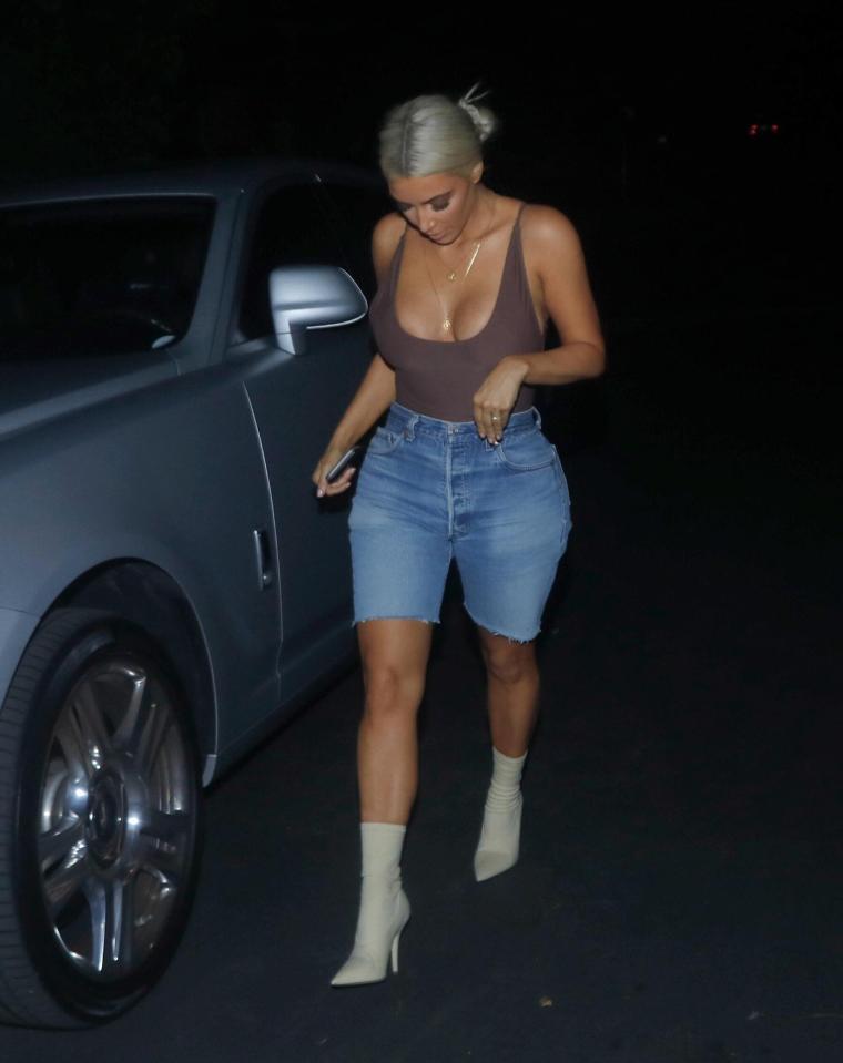  The 36-year-old showed off her famous cleavage in the racy garment which she teamed with a pair of denim shorts and cream heeled boots