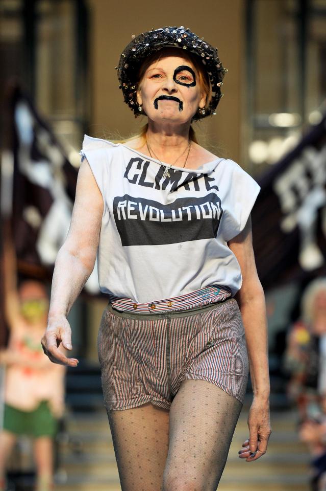  Vivienne Westwood, the godmother of punk, storms down her Red Label catwalk in 2003 in a 'Climate Revolution' T-shirt and face paint