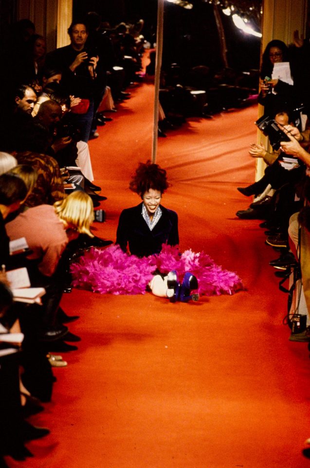  Naomi Campbell laughs hysterically after falling over in her nine-inch platform heels during the Vivienne Westwood catwalk show in 1993