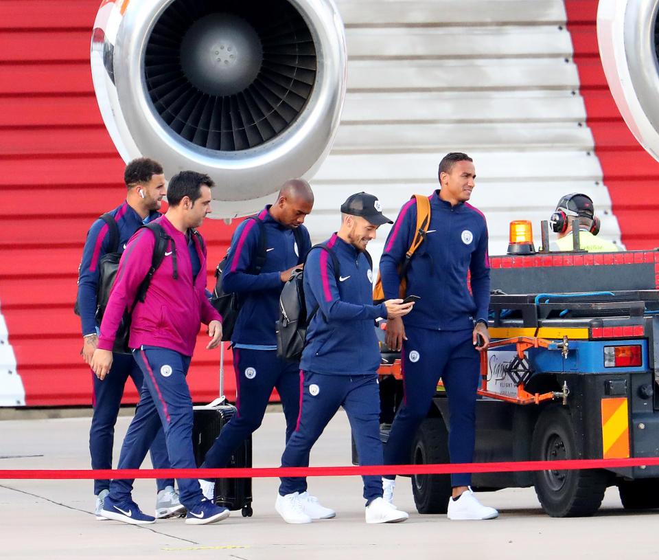 Kyle Walker, David Silva, Danilo and Fernandinho head towards the jet