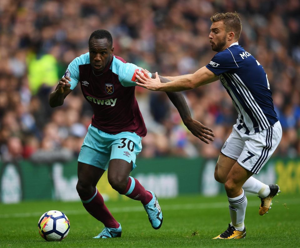 Michail Antonio looks to power past James Morrison