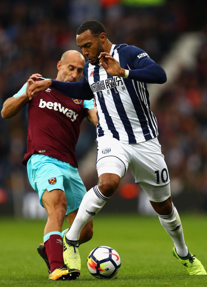 Pablo Zabaleta puts in a strong challenge on Matty Phillips