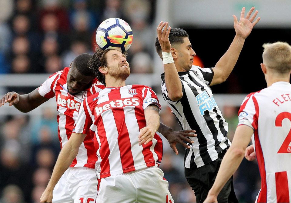 Joe Allen and Bruno Martins Indi tussle with Newcastle midfielder Ayoze Perez 