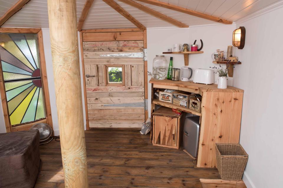  The shed has a trap door and a stained glass window