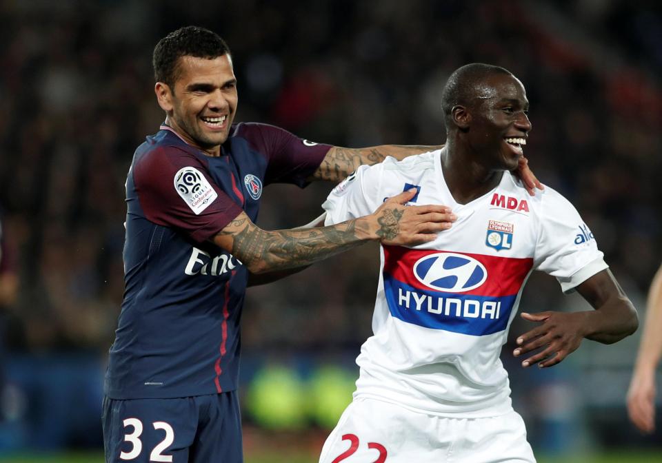 Dani Alves shares a joke with Lyon ace Ferland Mendy