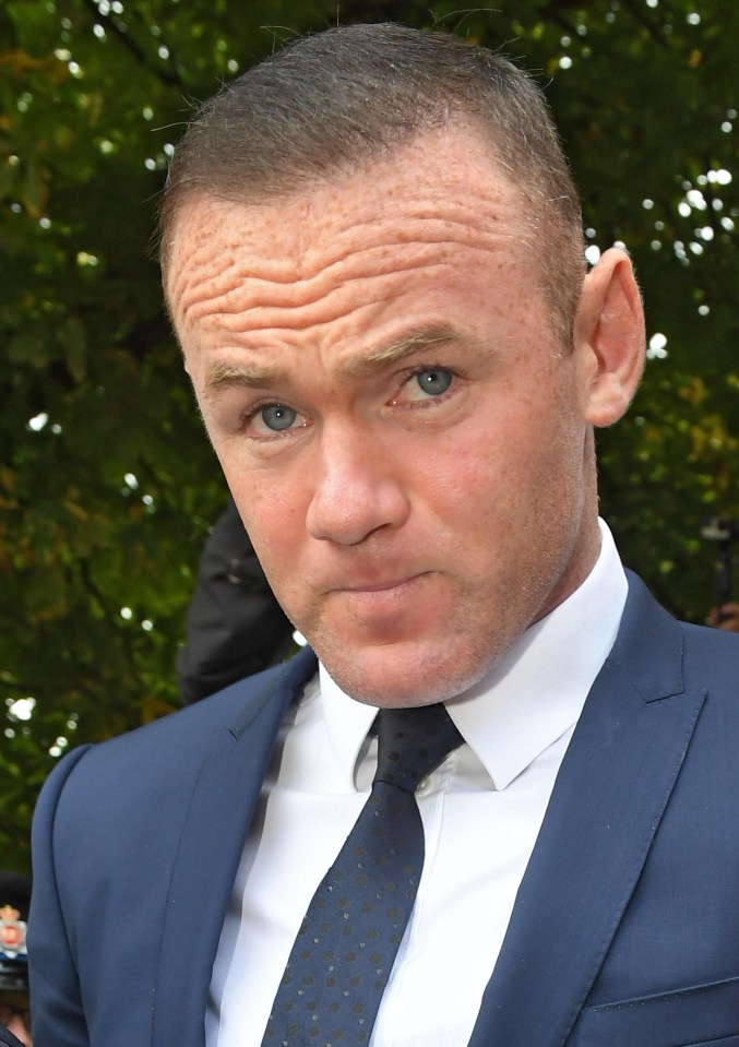 Wayne Rooney looked downcast as he left court 