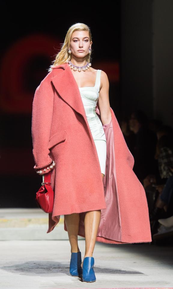  Hailey Baldwin modelled a rose-coloured mohair pea-coat that’s priced at £165, and an £85 mint green satin mini dress