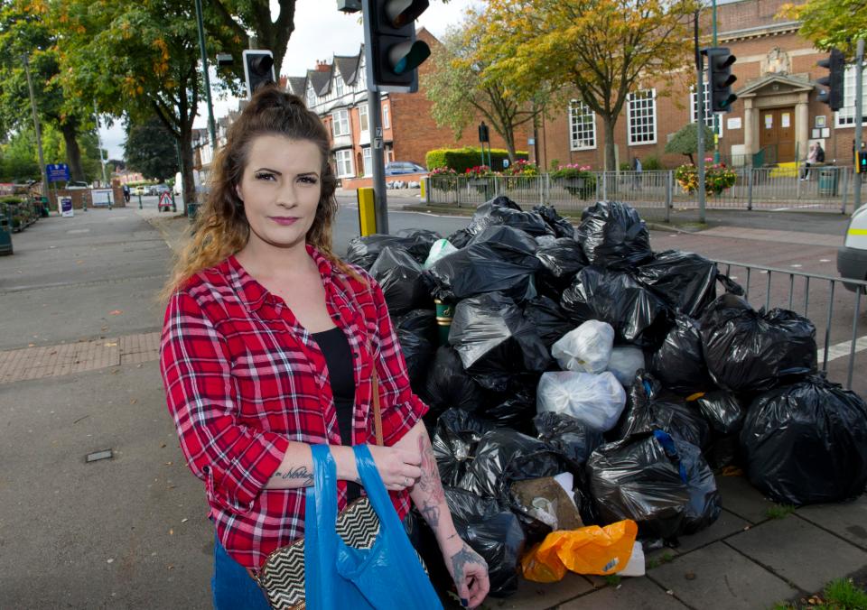  Local resident and full time mum Sandra Harper, 28, with the stinking pile of rubbish