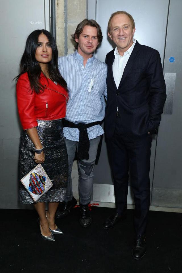  Designer Christopher Kane, middle, poses for a photograph with actress Salma Hayek and her husband Francois-Henri Pinault