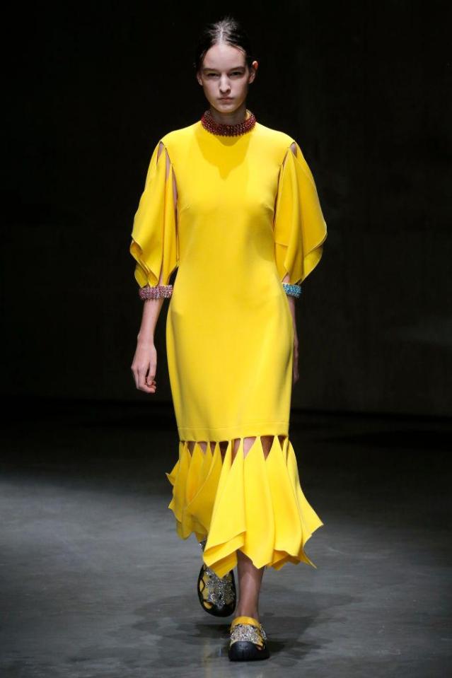  The controversial footwear was paired with brightly coloured midi dresses