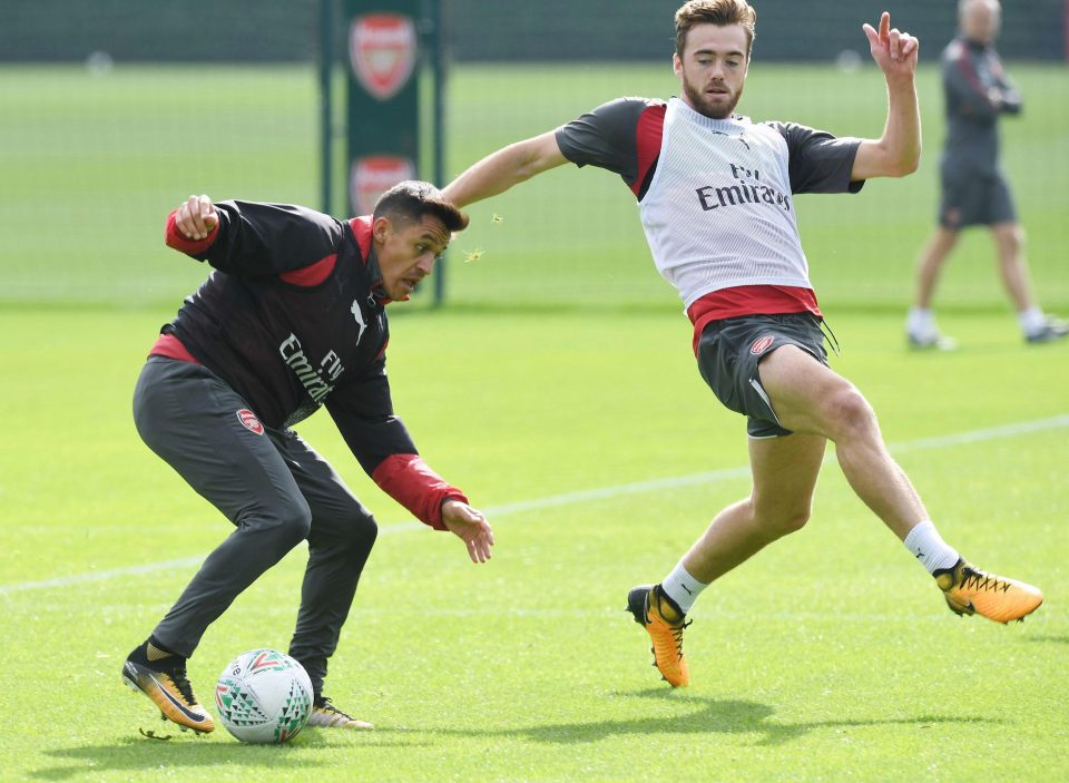  Sanchez in action with Calum Chambers on their London Colney pitches