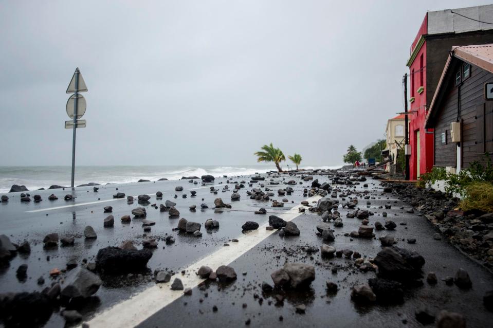  Rocks swept by strong waves onto a road in Le Carbet, on the French Caribbean island of Martinique