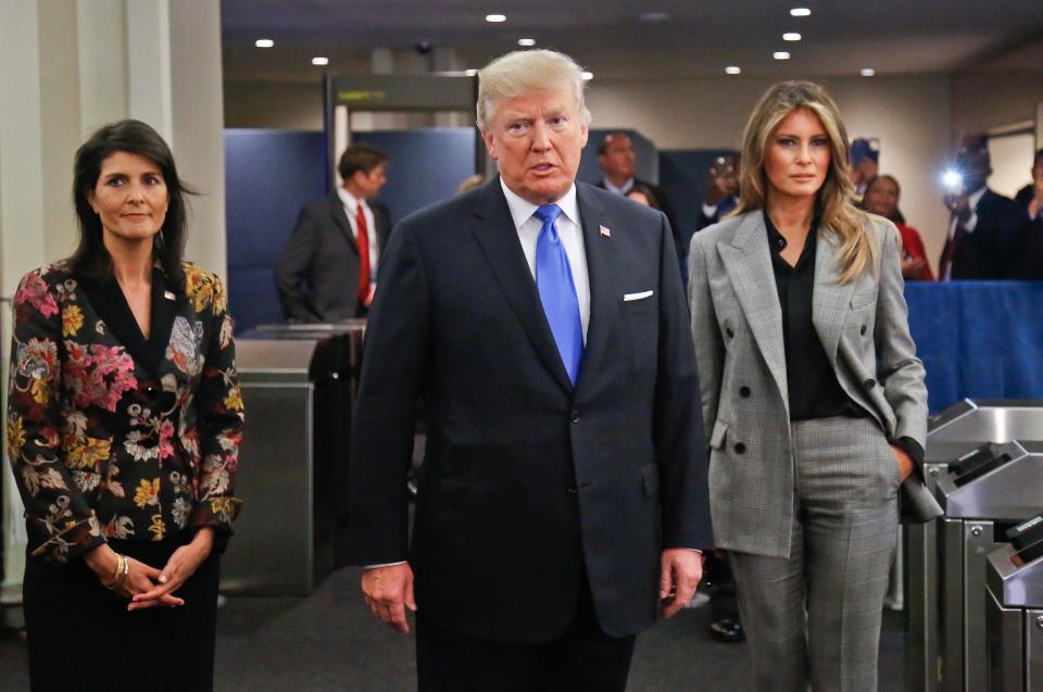  Trump and wife Melania, right, arrive before his speech with American UN ambassador Nikki Haley