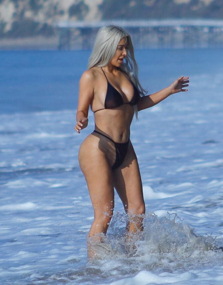  Kim Kardashian's famously curvaceous bum looked bigger and better than ever in a sexy thong bikini