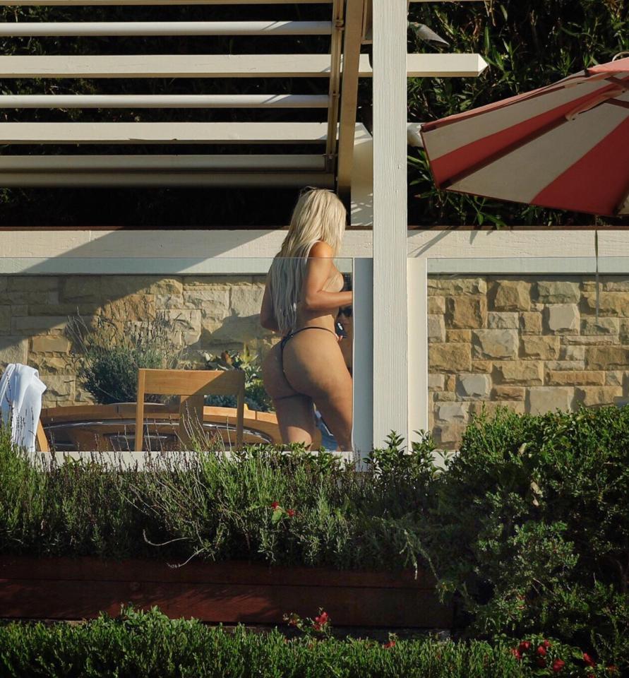  Kim's hair ran all the way down her back and reached the top of her bum