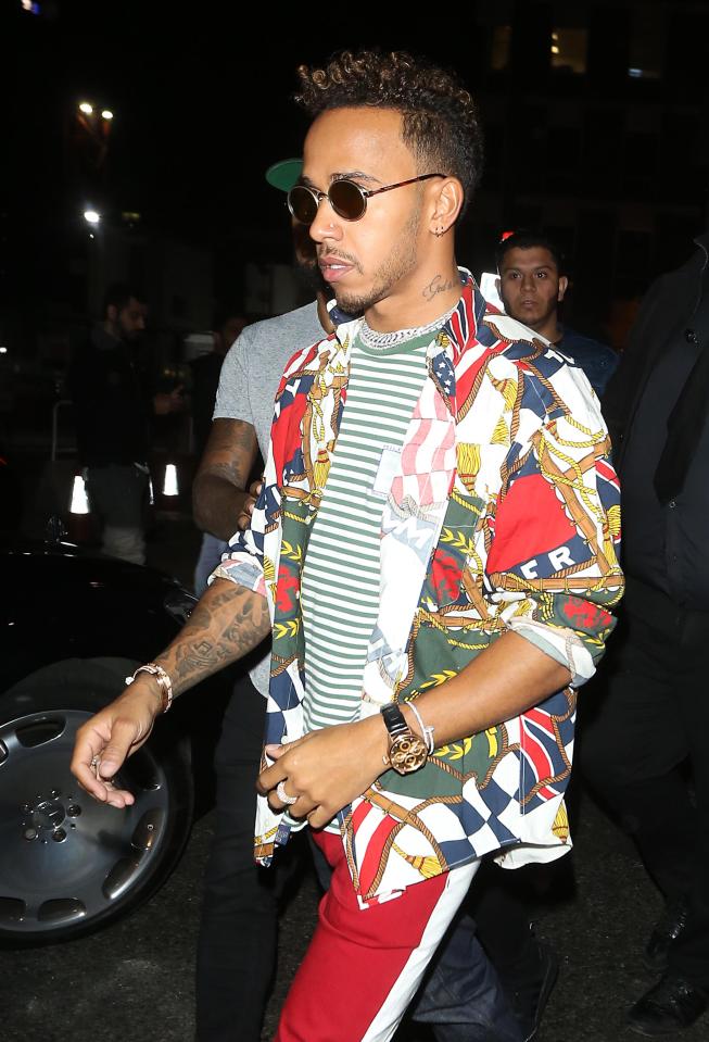 In other pictures, Lewis Hamilton was snapped wearing a jazzy sailing flag-inspired shirt