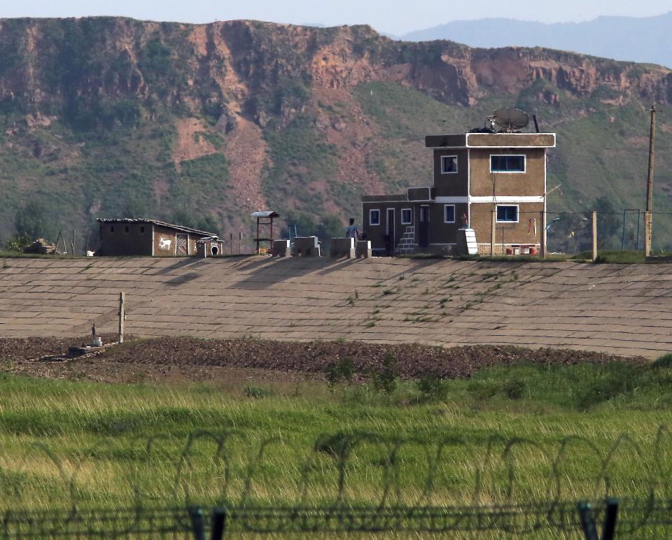  A North Korean border's entry outpost stands watch near Sinuiju, across the Yalu River from China