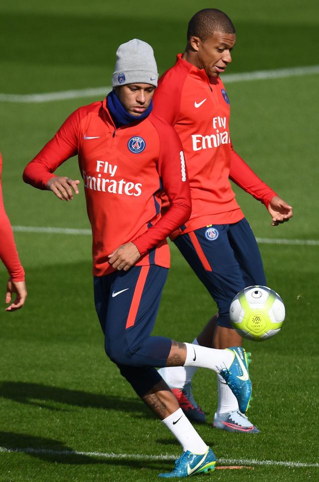 A chilly-looking Neymar shows off his fancy footwork during PSG training on Thursday morning