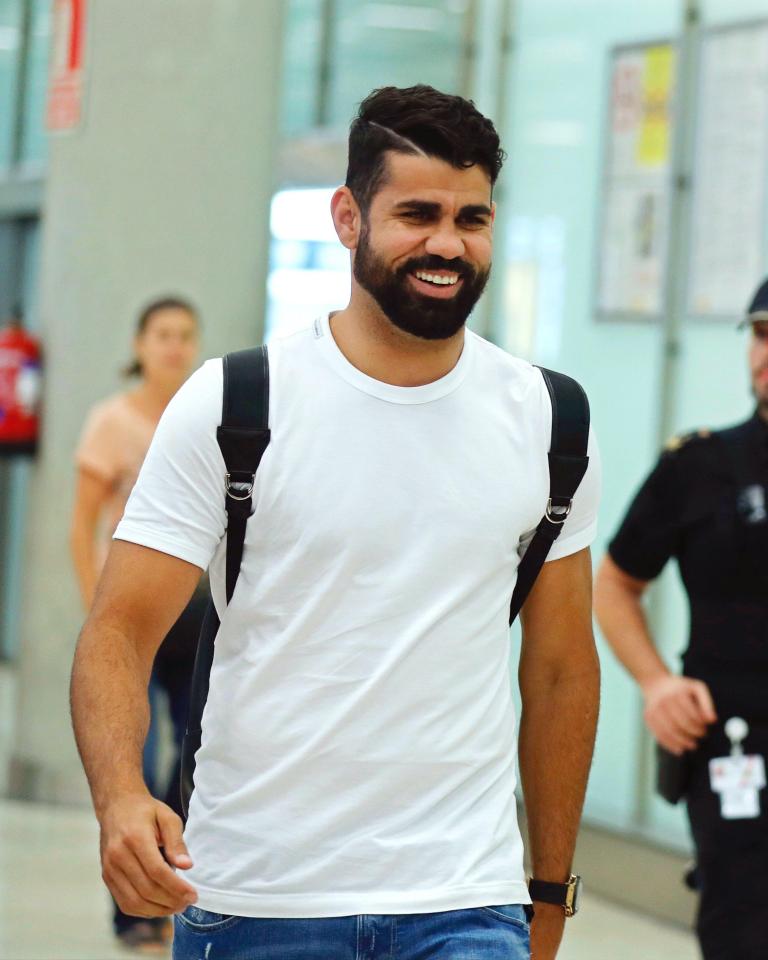 A smiling Diego Costa arrives in Madrid ahead of return to Atletico Madrid