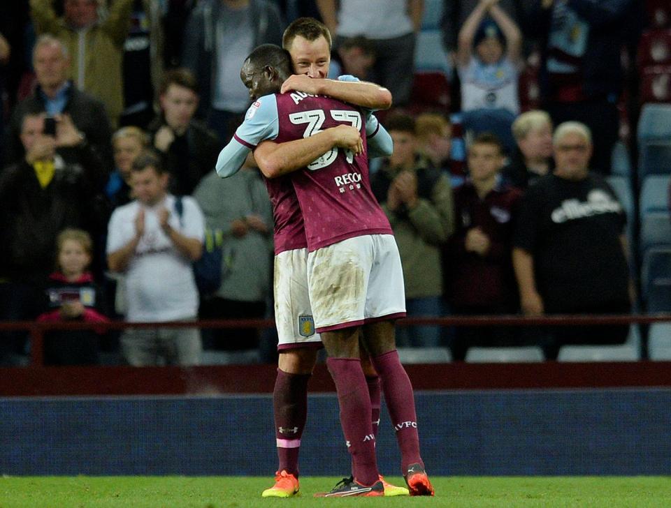  John Terry and Albert Adomah embrace after Adomah's opener