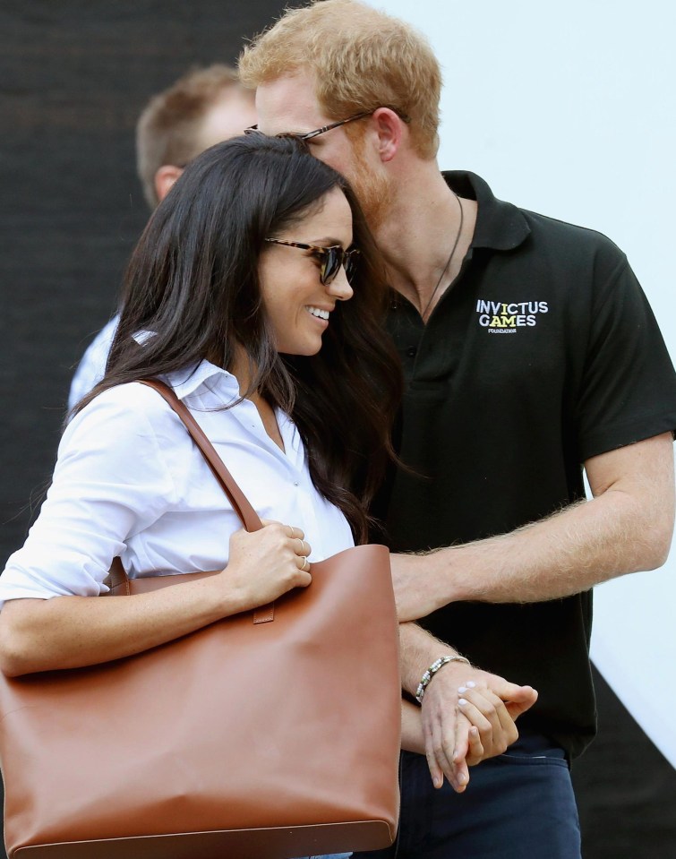 Prince Harry did not shy away from showing his girlfriend attention in public