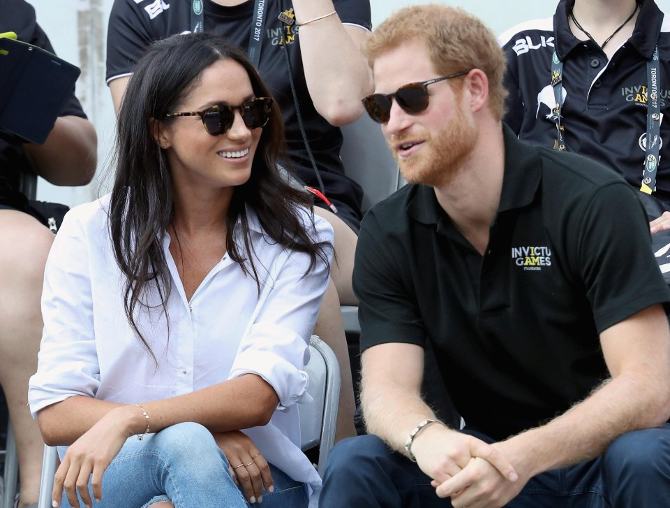 The couple couldn't keep the smiles off their faces as they finally got to sit together