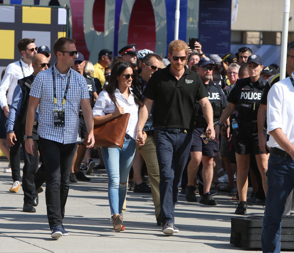 Royal fans tried to snap a photograph of the couple as they attended the event