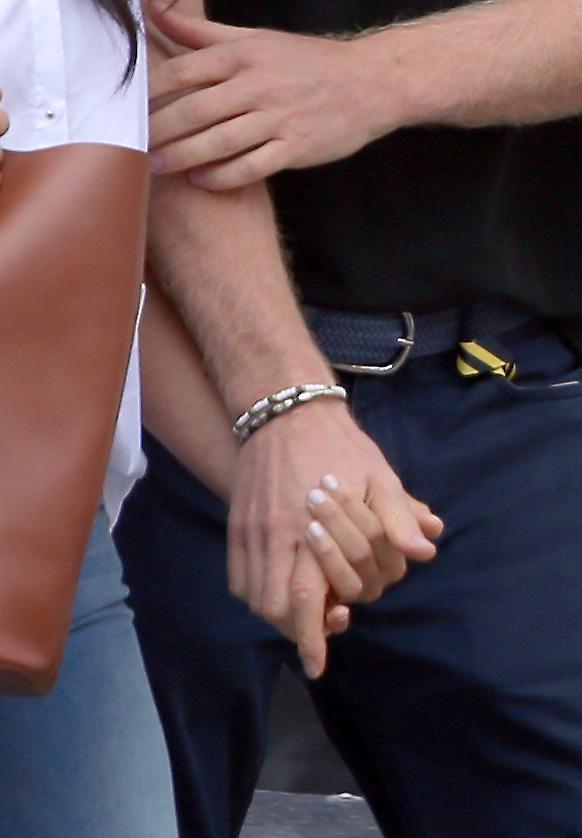 The couple held hands during the event