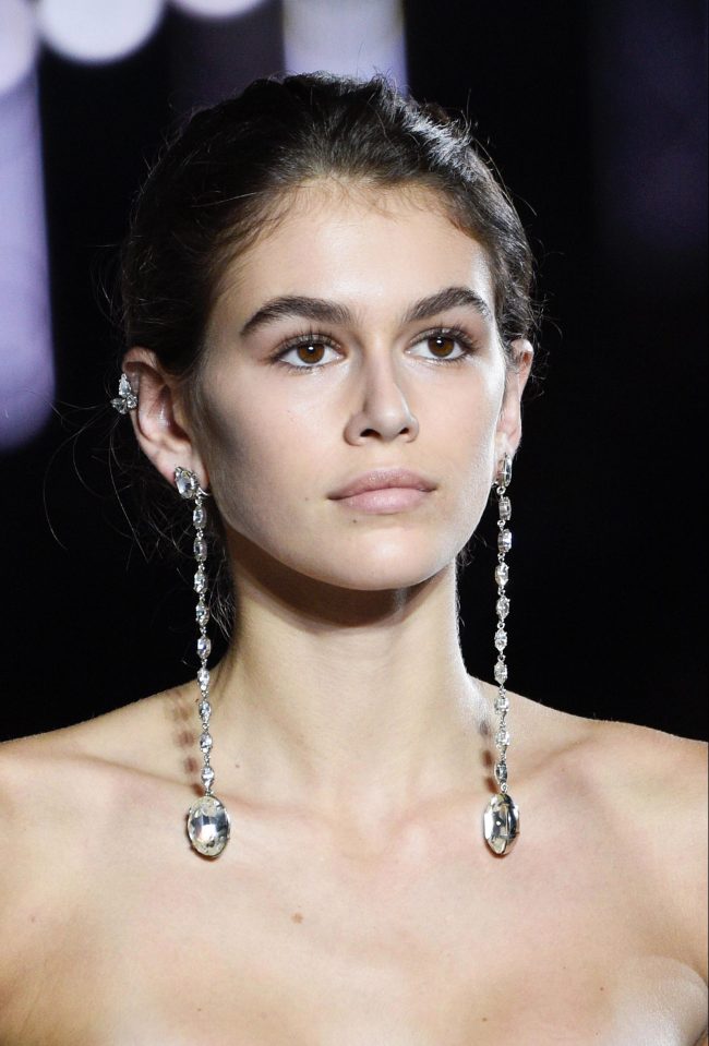  Kaia's make-up look was kept simple and her youthful glow shone through as she walked the runway