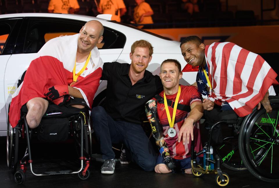 Harry also posed with the gold and bronze medal winners of the event