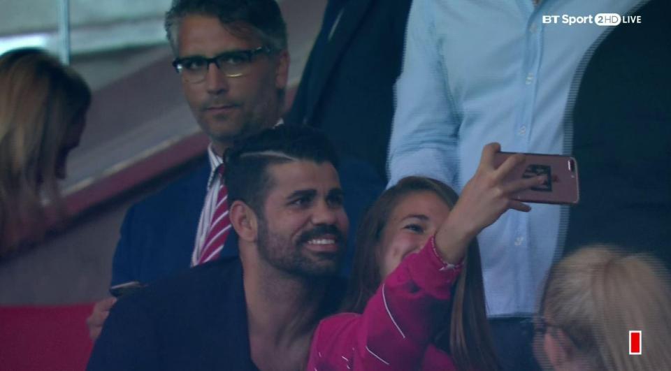 Diego Costa takes a selfie with a fan in the stands