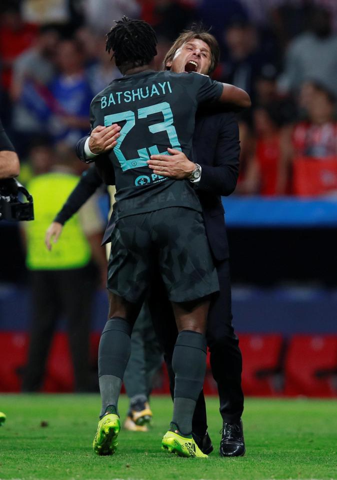 Michy Batshuayi celebrates with manager Antonio Conte at full time