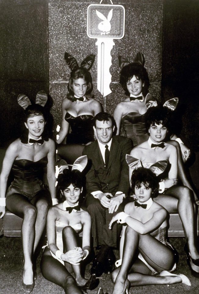  Hugh, surrounded by Playboy Bunnies, in 1964