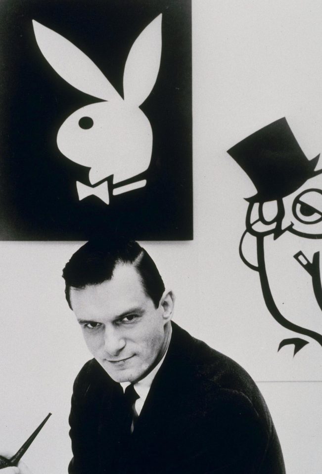  Hugh pictured with his rabbit logo in the early days of Playboy