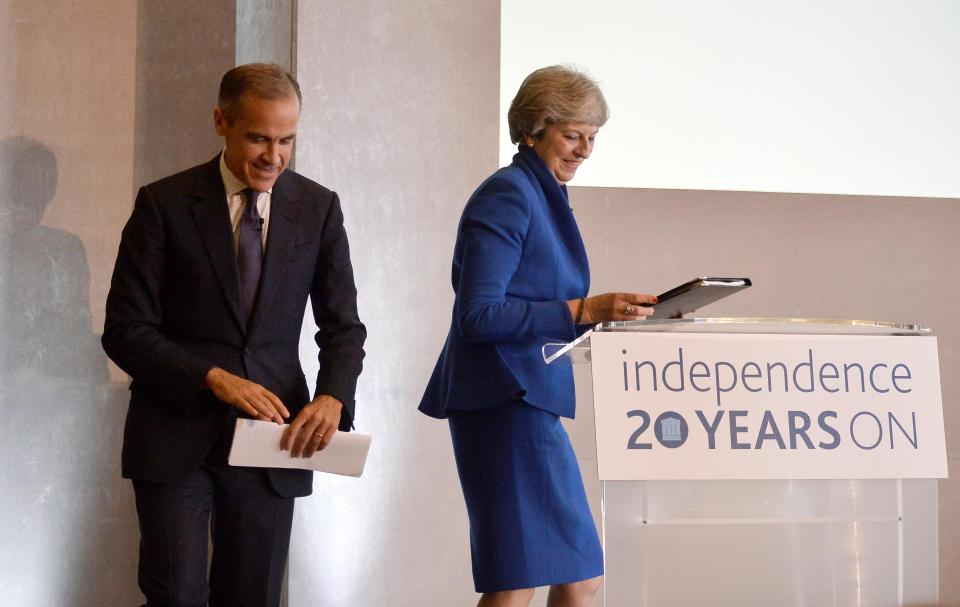  The PM with Bank of England boss Mark Carney at her speech