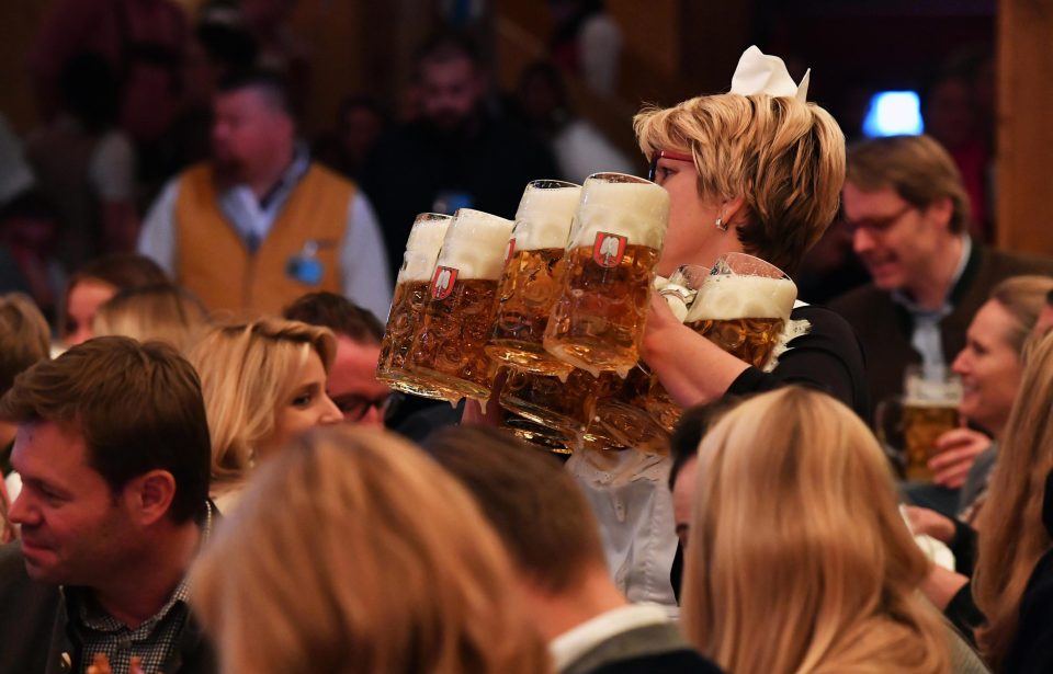  The first 1 litre mass beers of the festival are served in the Schottenhamel tent