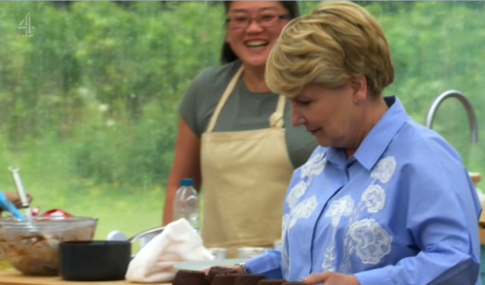 The presenter takes over the other side of the baking station