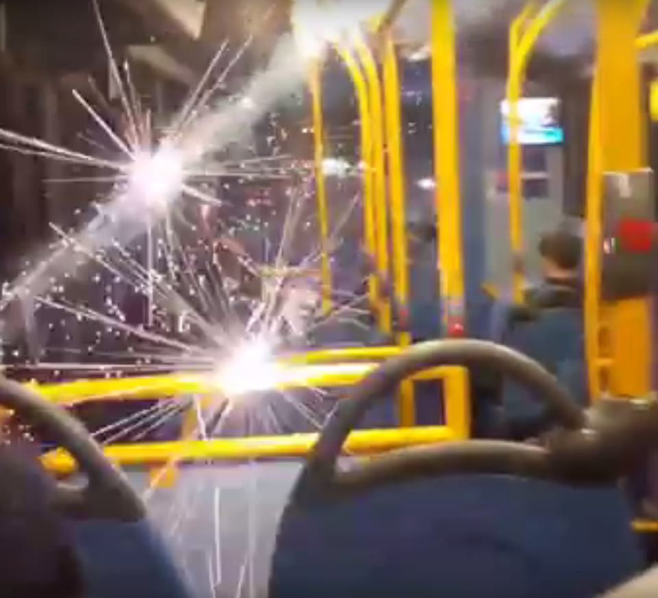 Sparks can be seen flying around the bus