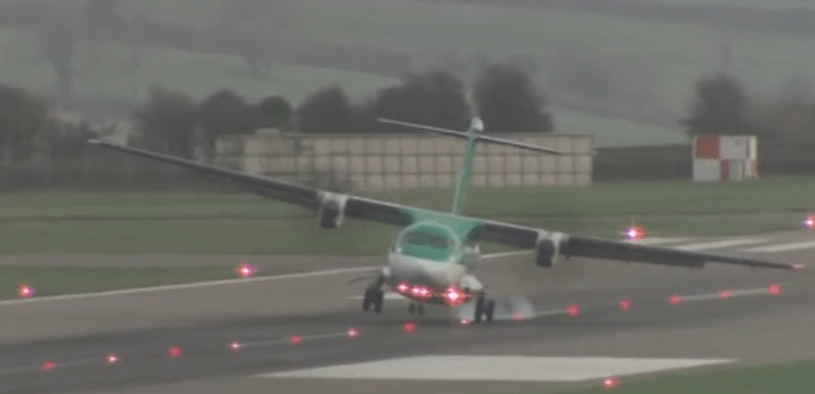  Smoke comes from the wheels as the plane slammed onto the runway