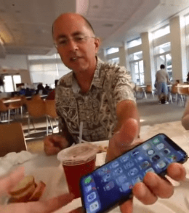  Her dad pictured at the Apple HQ in California appears to let his daughter play with the phone